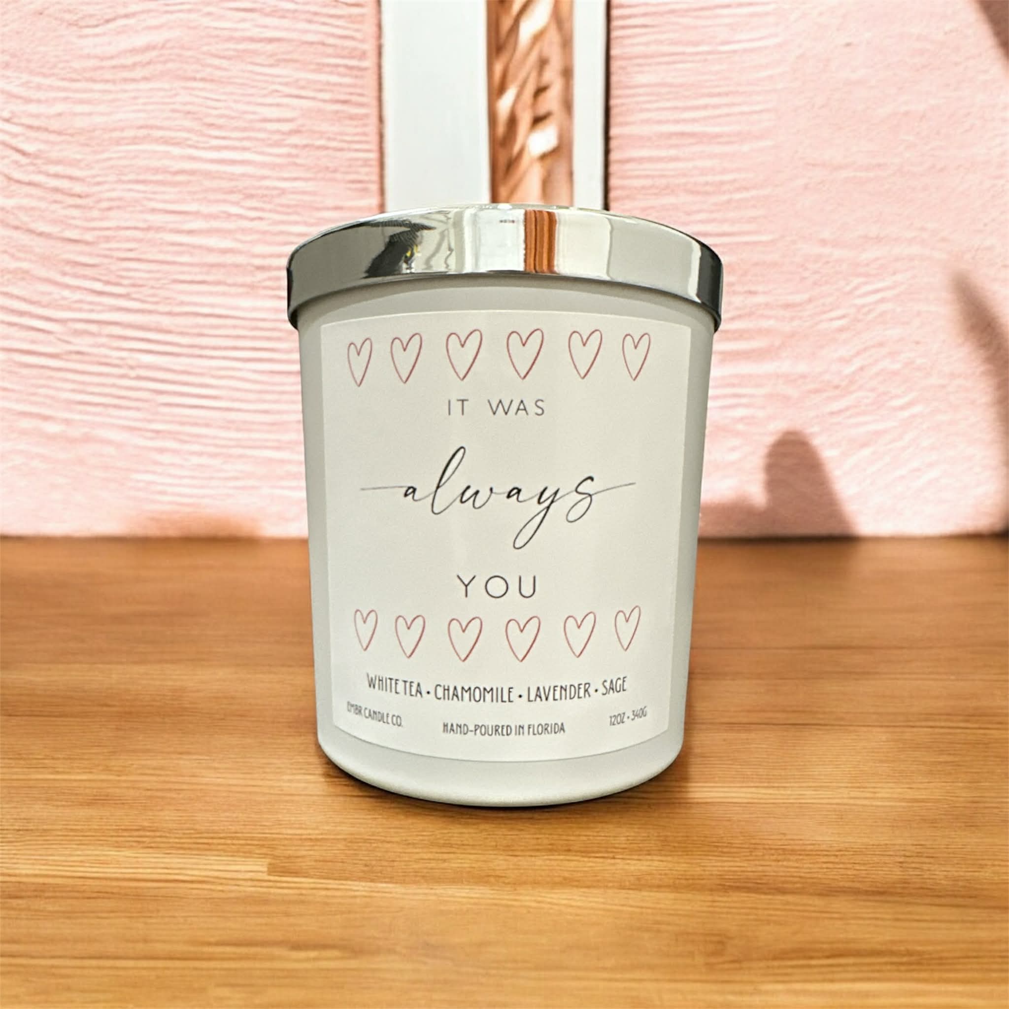 It Was Always You soy wax Valentine’s Day candle gift with heart design, hand-poured and set on a wooden surface with a pink background.