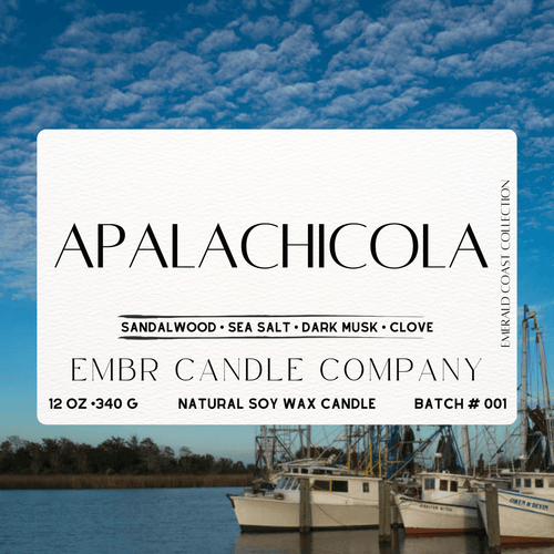 Label of Apalachicola Soy Wax Candle - Coastal Aroma | Clean burn, featuring sandalwood, sea salt, dark musk, and clove from the Emerald Coast Collection.