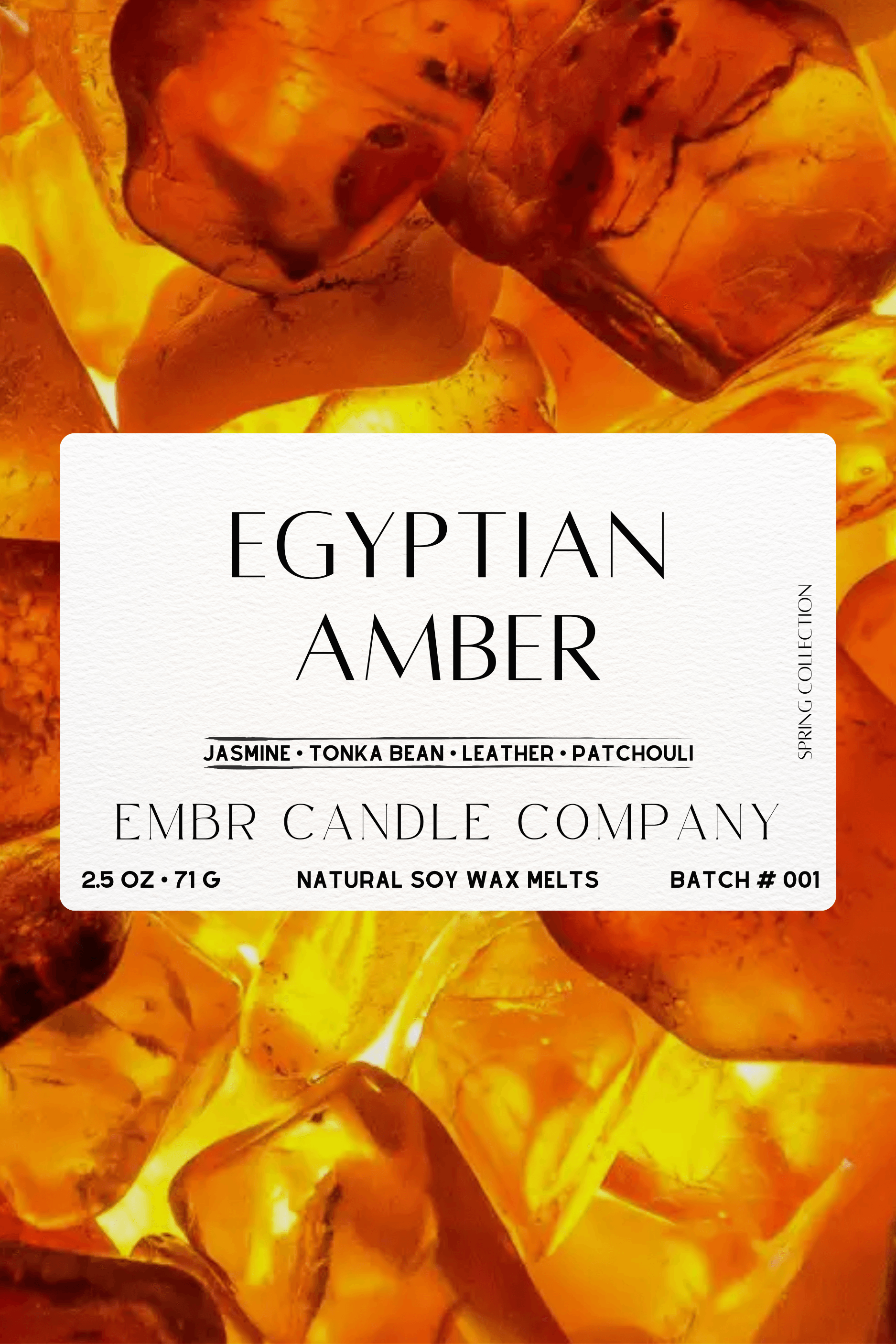 Close-up label of Egyptian Amber Soy Wax Melt by Embr Candle Company, highlighting jasmine, tonka bean, leather, and patchouli blend.