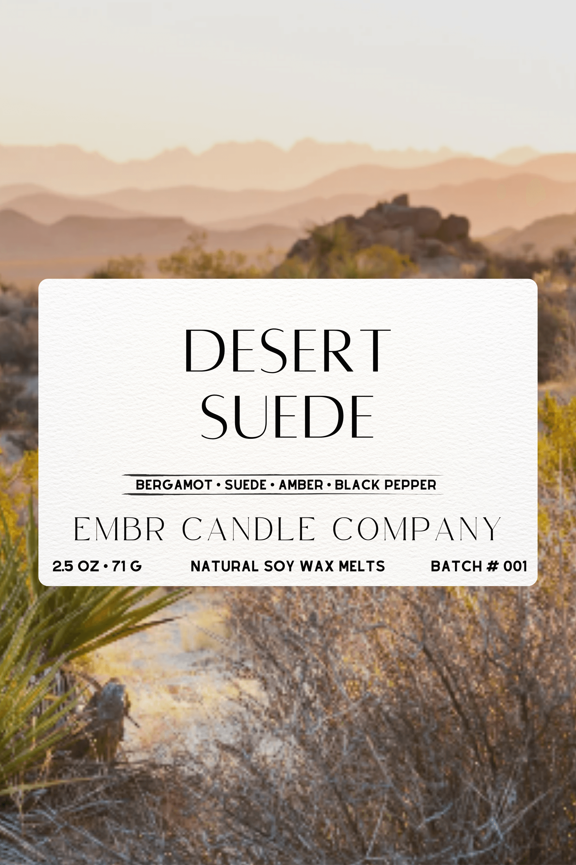 Desert Suede - 2.5 Oz Soy Wax Melt label with notes of bergamot, suede, amber, and black pepper over a desert landscape background.