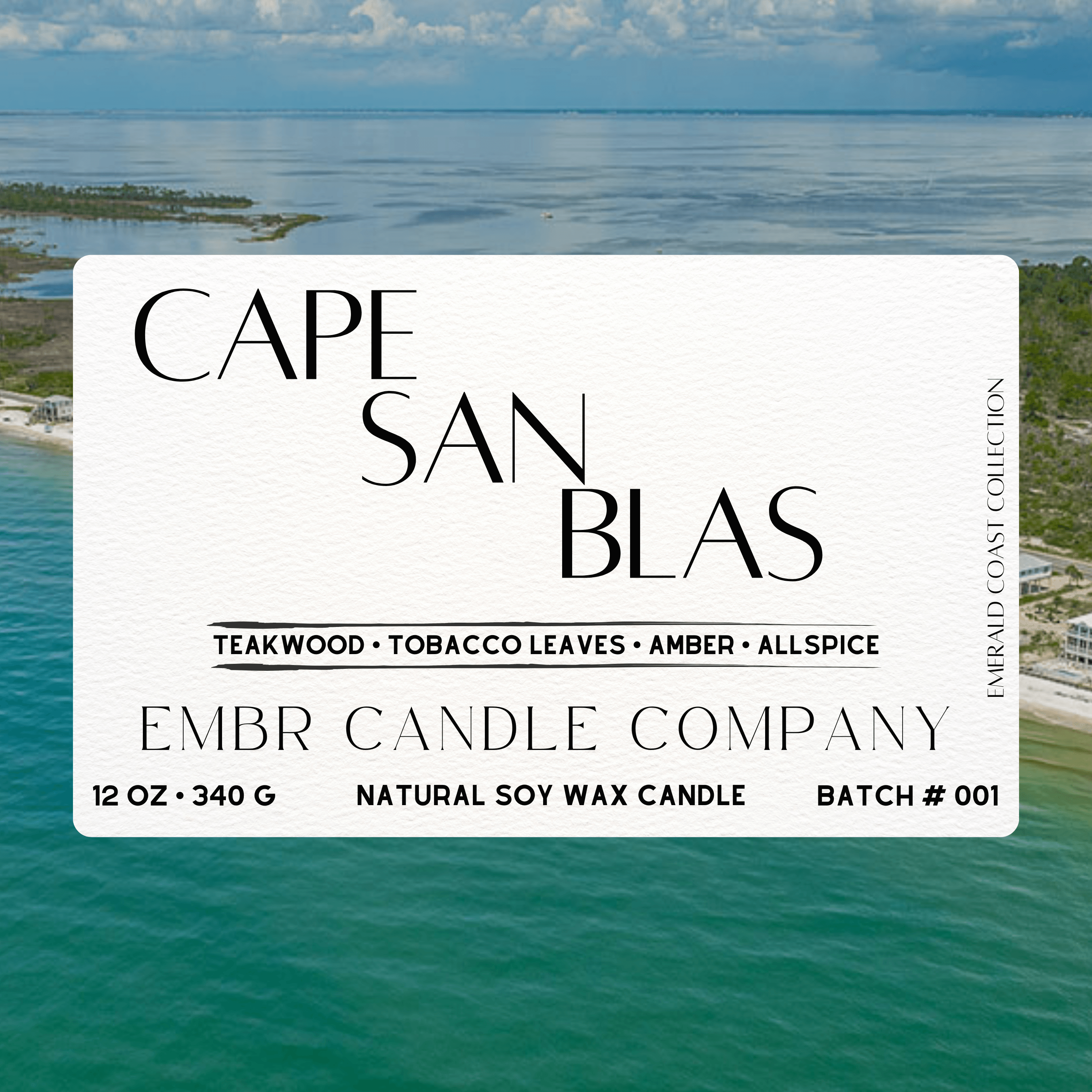 Label of Cape San Blas - Emerald Coast Collection - Soy Wax Candle showing scent notes of teakwood, tobacco leaves, amber, and allspice over ocean backdrop.
