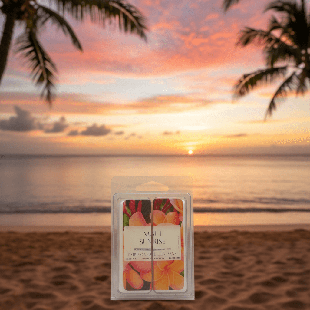 Maui Sunrise Wax Melt 2.5 Oz clamshell displayed on a tropical beach at sunset, ideal for home fragrance lovers seeking a soy-based scent.